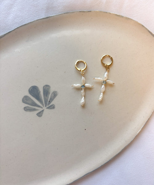 Dainty Pearl Cross Earrings handcrafted handmade jewelry displayed on ceramic dish