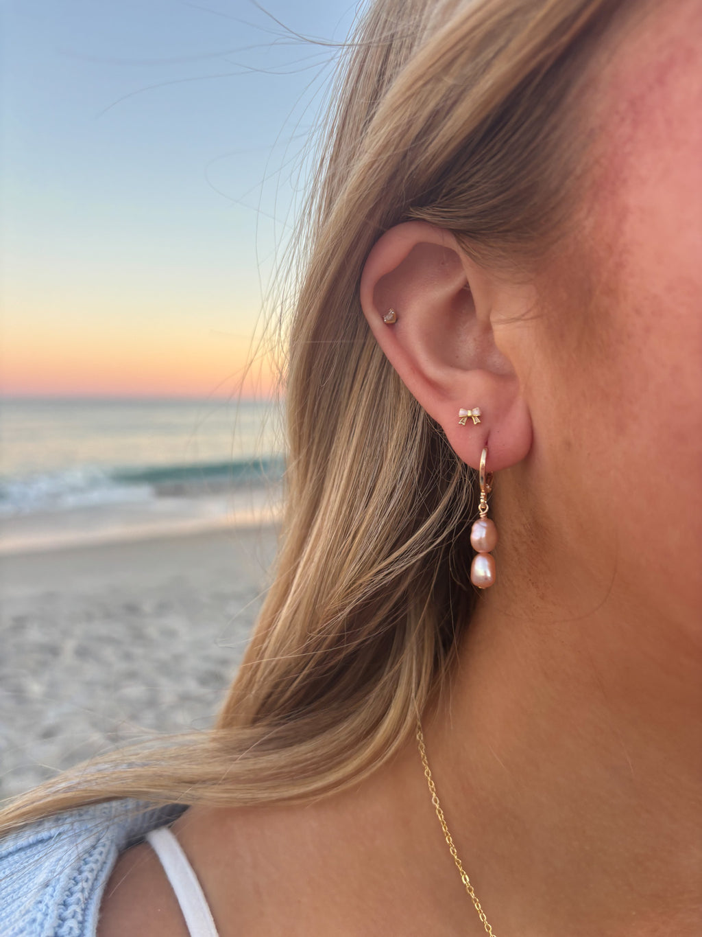 Rosetta Coast Pearl Earrings handmade jewelry featuring pink freshwater pearls styled as feminine beach jewelry at sunset