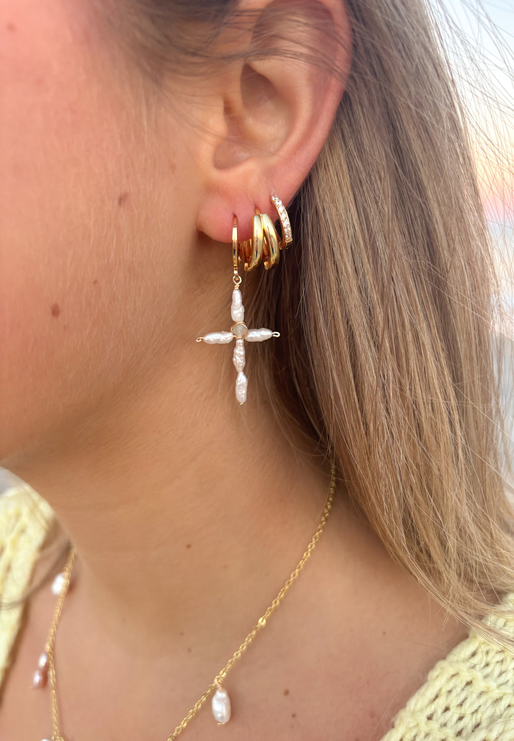 Dainty Pearl Cross Earrings handmade jewelry with freshwater pearls and aquamarine bead worn at the beach