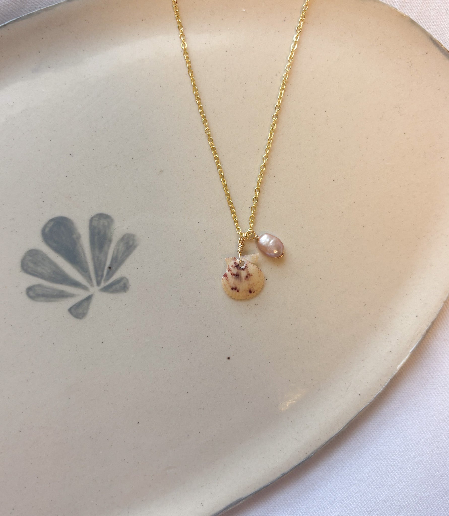 Blush Harbor Shell Necklace handmade jewelry featuring calico scallop shell and pink pearl beach jewelry design.