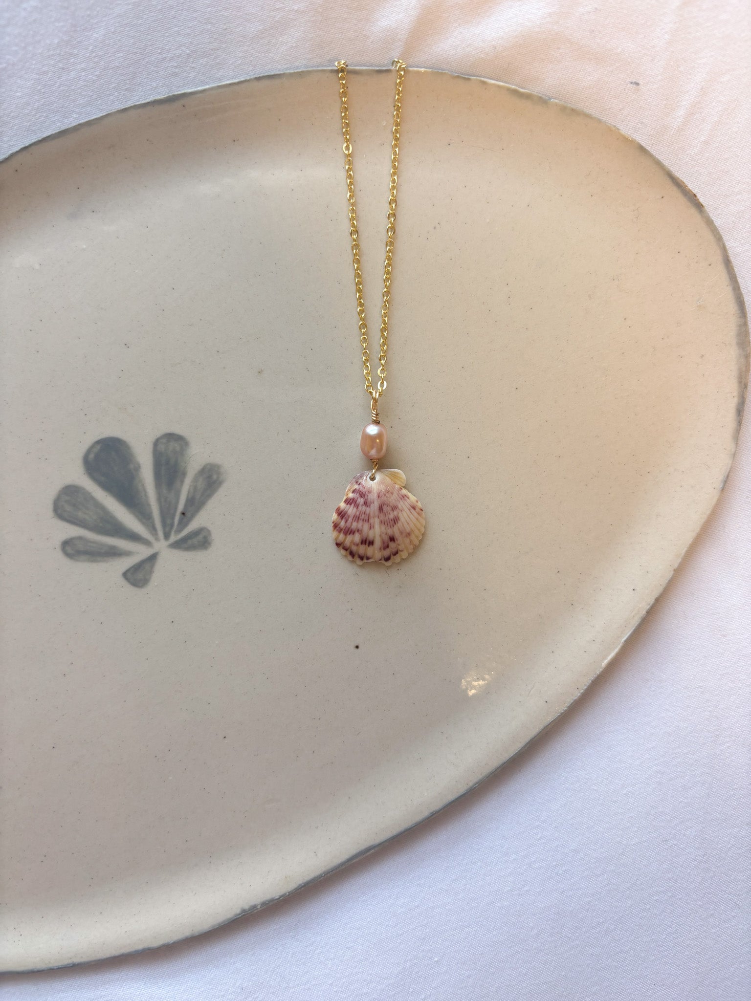 Rosie Bay Calico Scallop Necklace handmade jewelry featuring real scallop shell and pearl charm beach jewelry